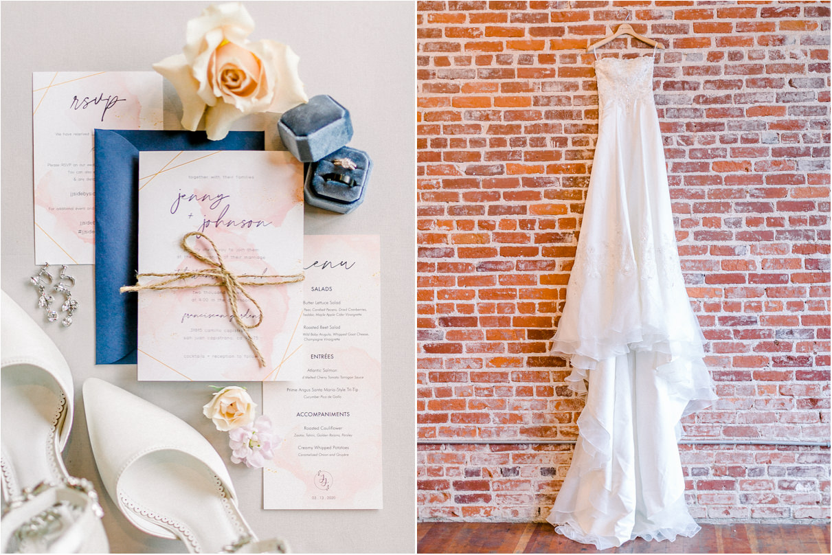 Wedding invitation, flowers, shoes, and wedding dress hanging on brick wall