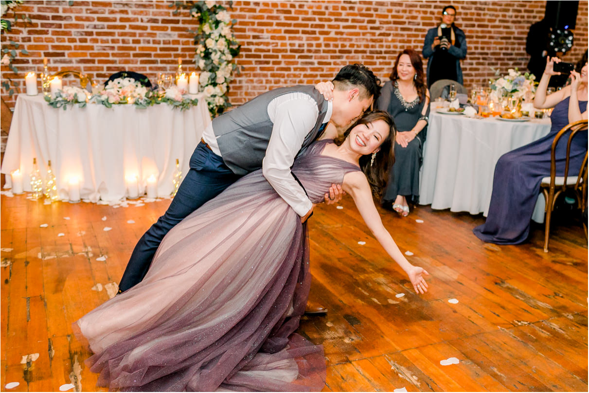 bride and groom doing deep dip at the end of their first dance