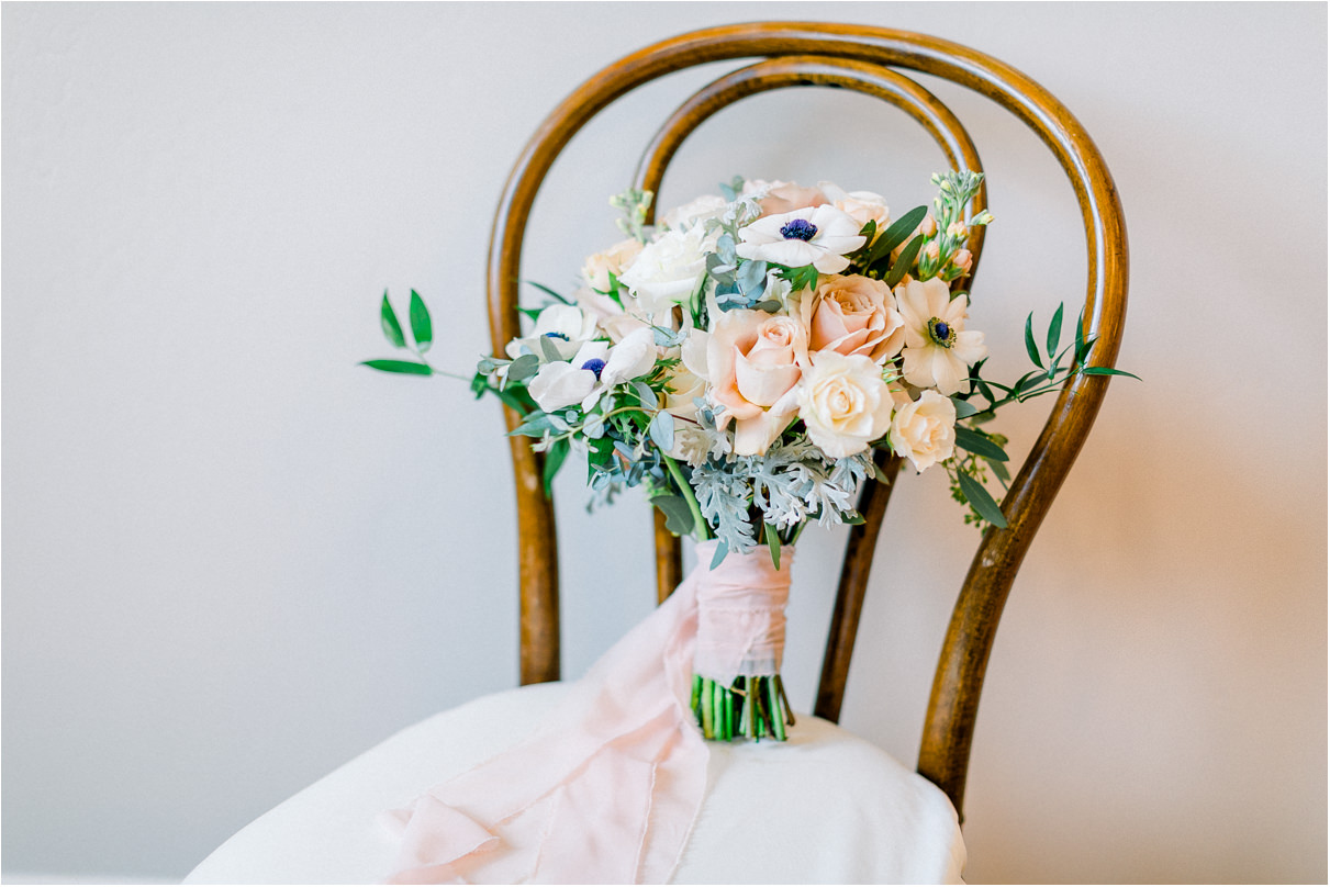 wedding bouquet on wood chair