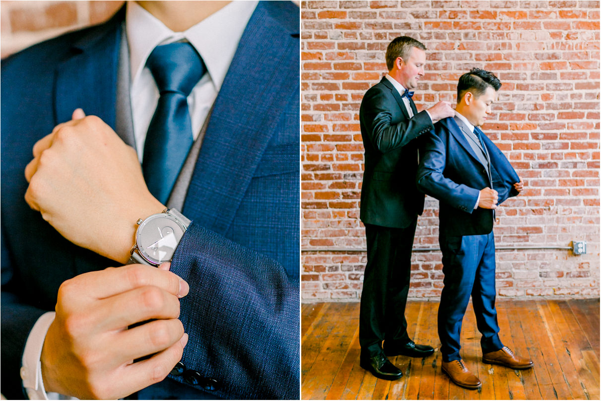 groom getting ready with best man and putting on watch