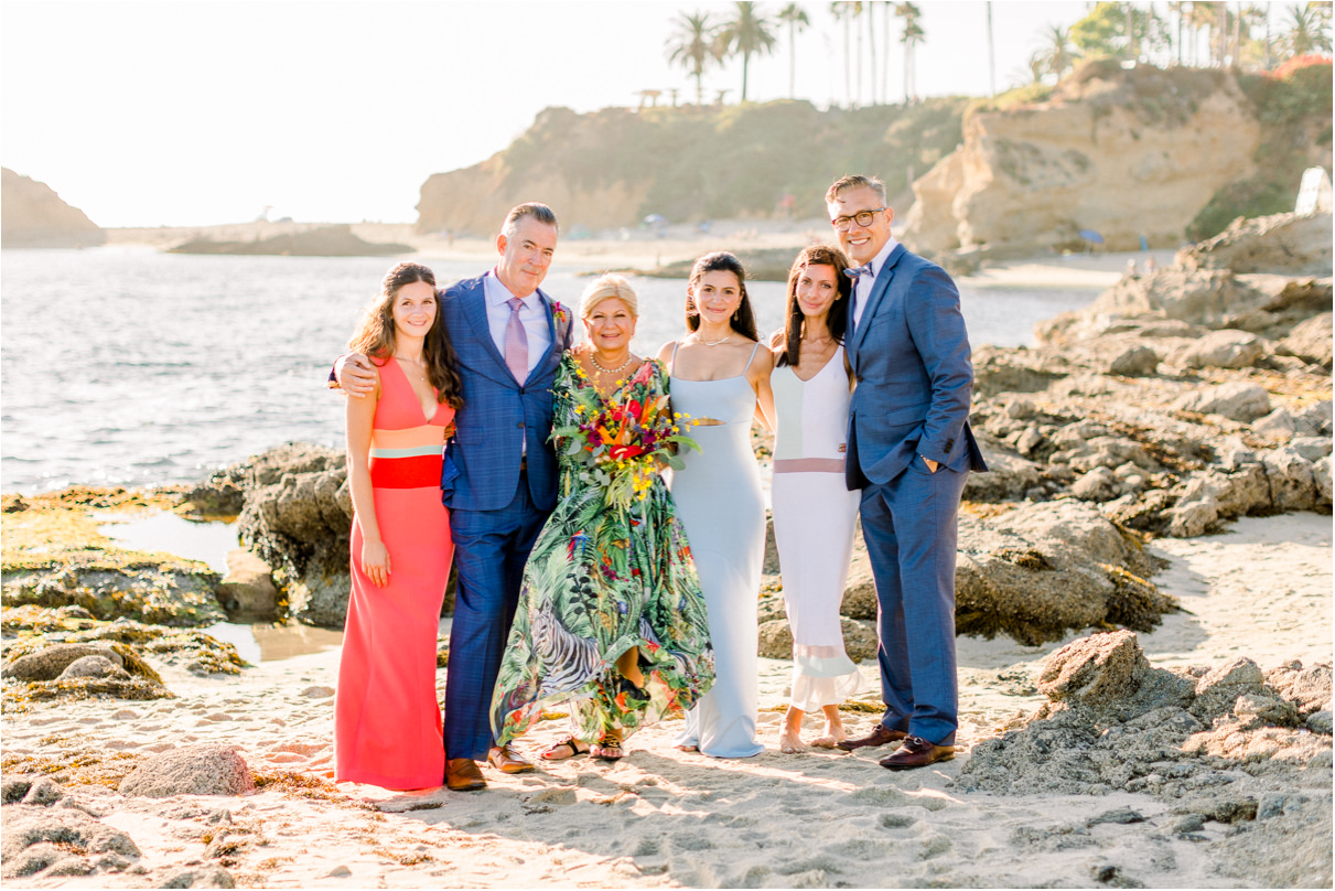 Family photo at the beach with fancy clothes