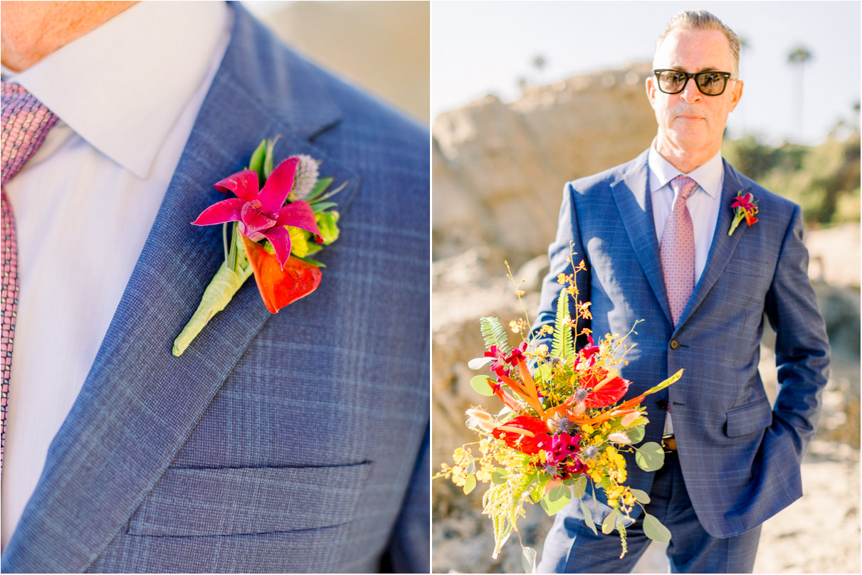 Man in blue checkered suit holding colorful bouquet