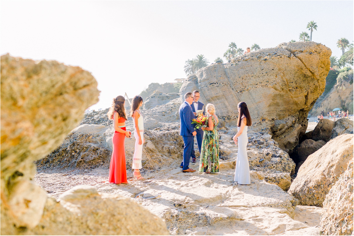 Six people at wedding ceremony at the beach