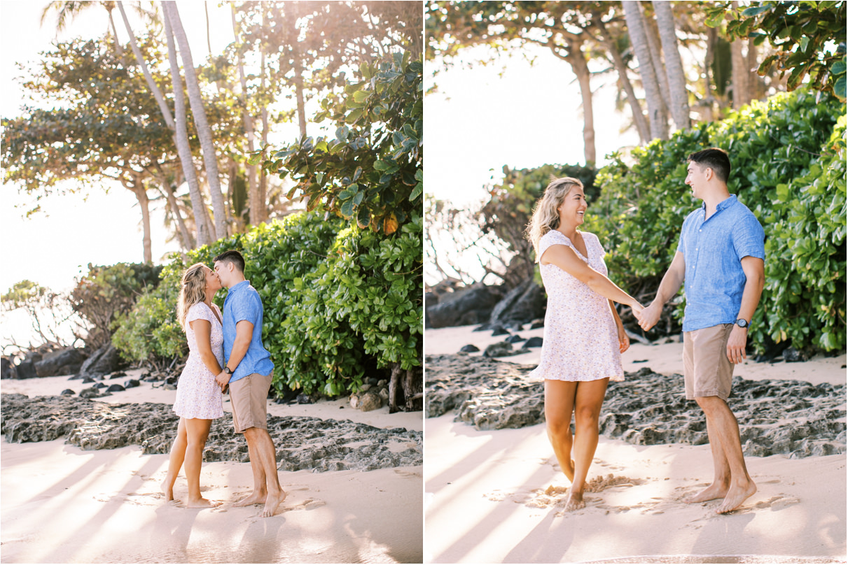 couple kissing and dancing on beach in hawaii with palm trees