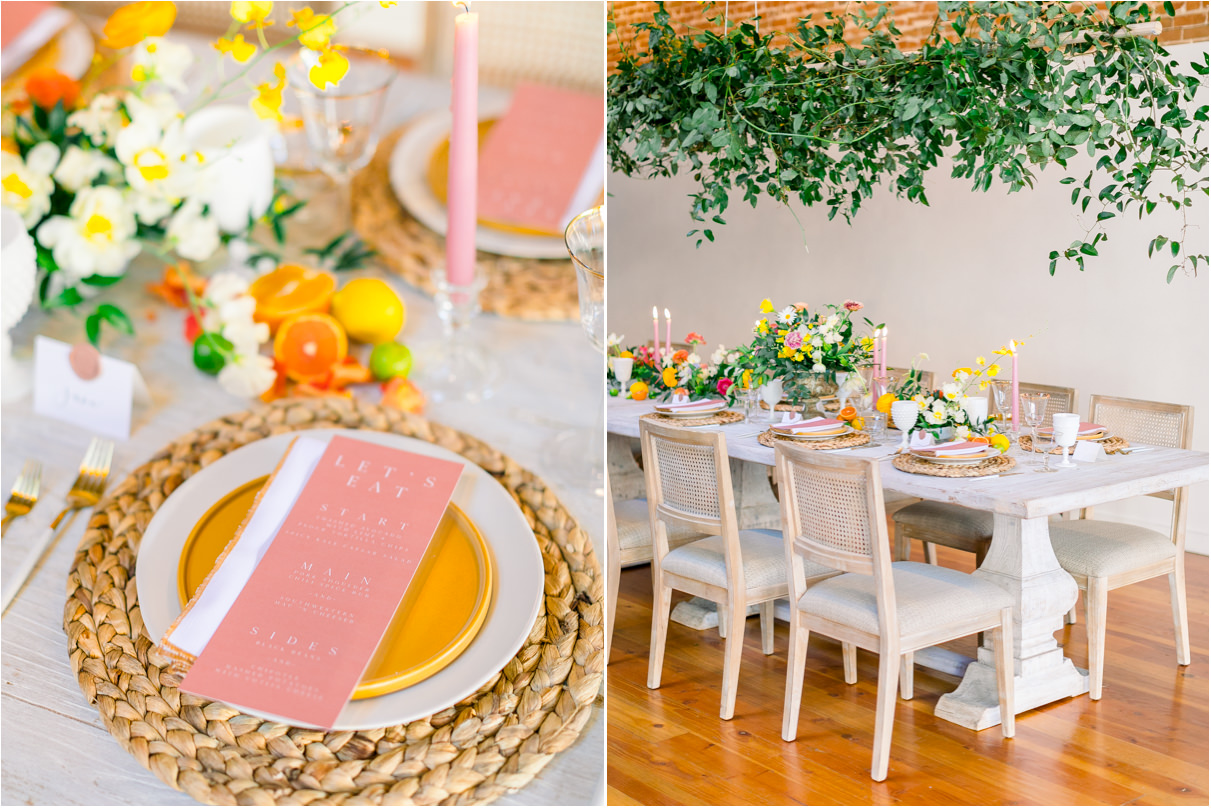 Wedding reception table with rattan placemat, yelllow plates, pink candles, and fruit.