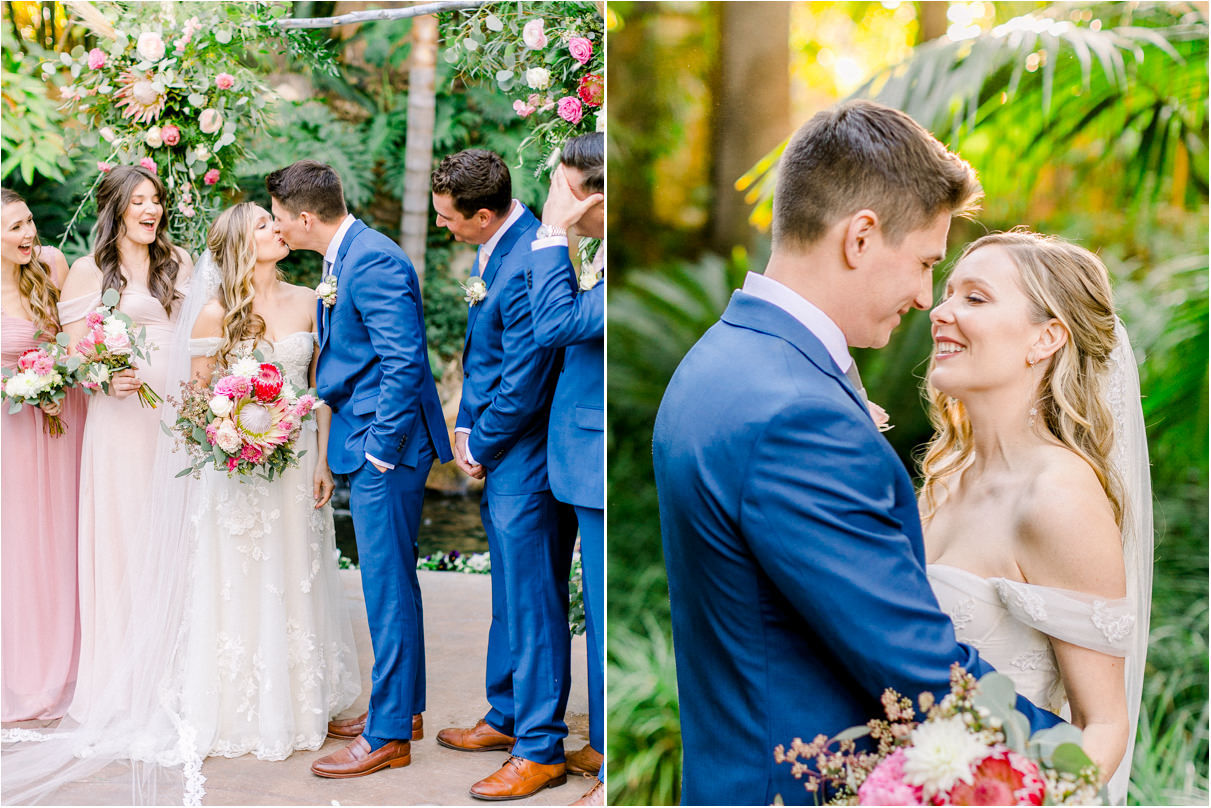 Bride and Groom kissing under altar in a lush green garden