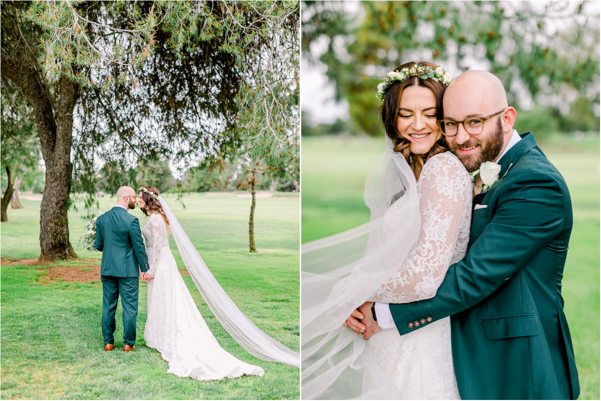 Bride and groom snuggling on golf course with long veil