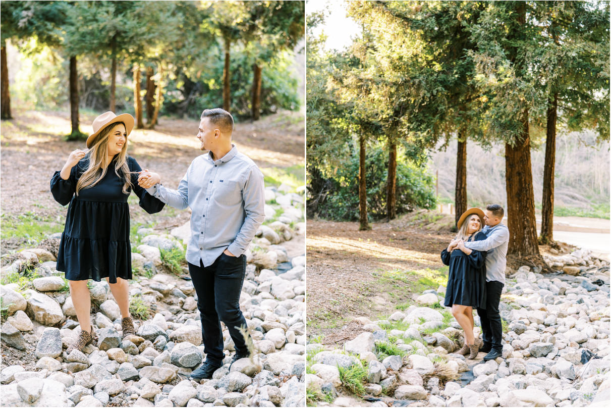 Couple holding each other walking along a river bed