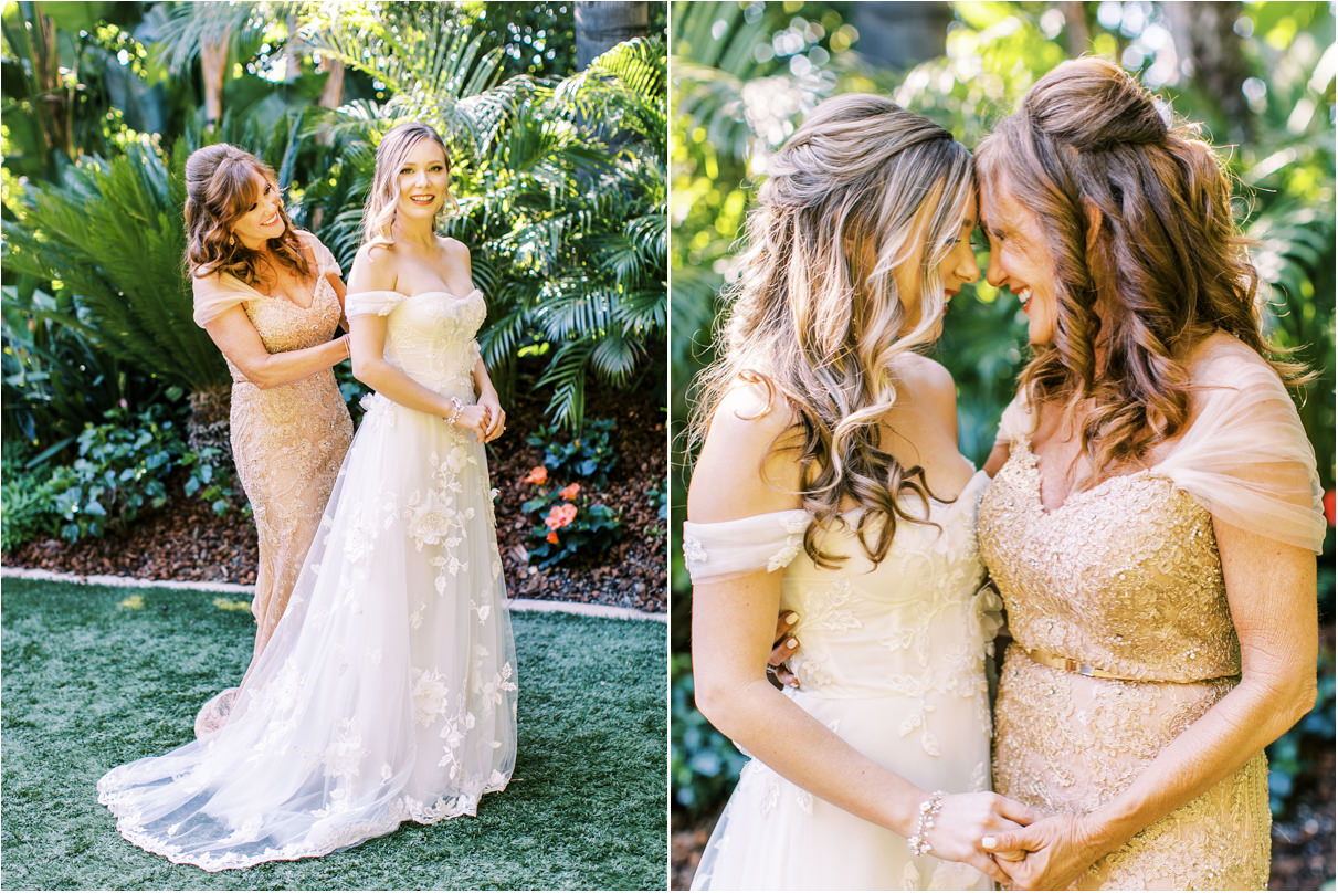 Mother of the bride helping zip her dress and smiling at each other