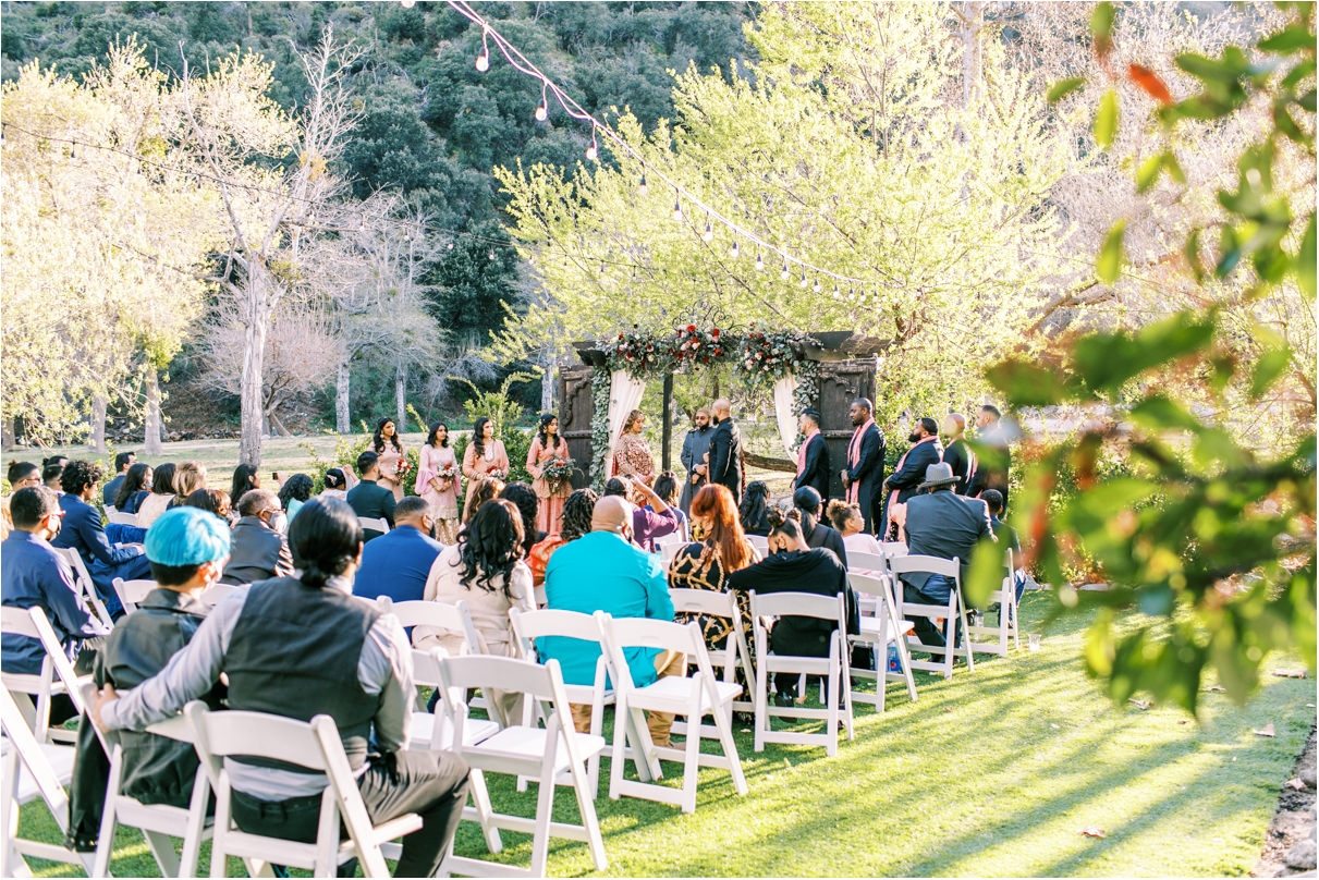Guests seated during wedding ceremony at Hidden Acres Wedding Venue