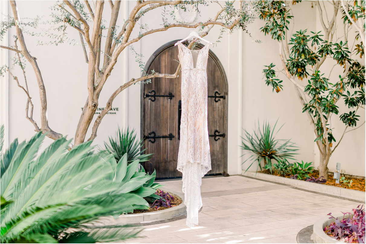 Wedding dress hanging in courtyard of Monarch Beach resort