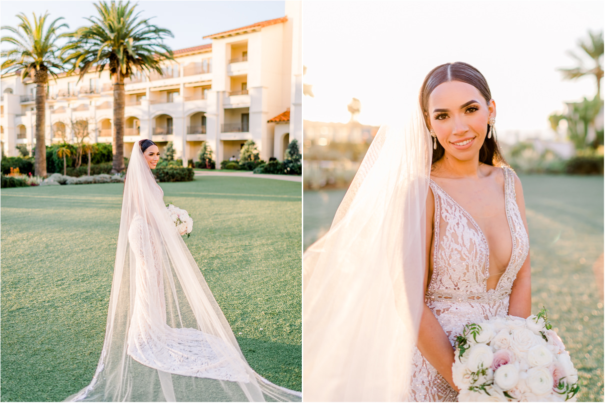 Bride with cathedral length veil holding wedding bouquet