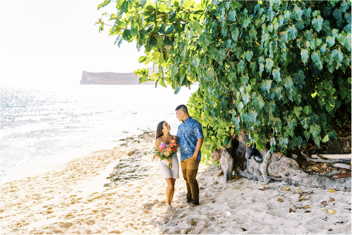 Couple looking at each other during engagement session in hawaii