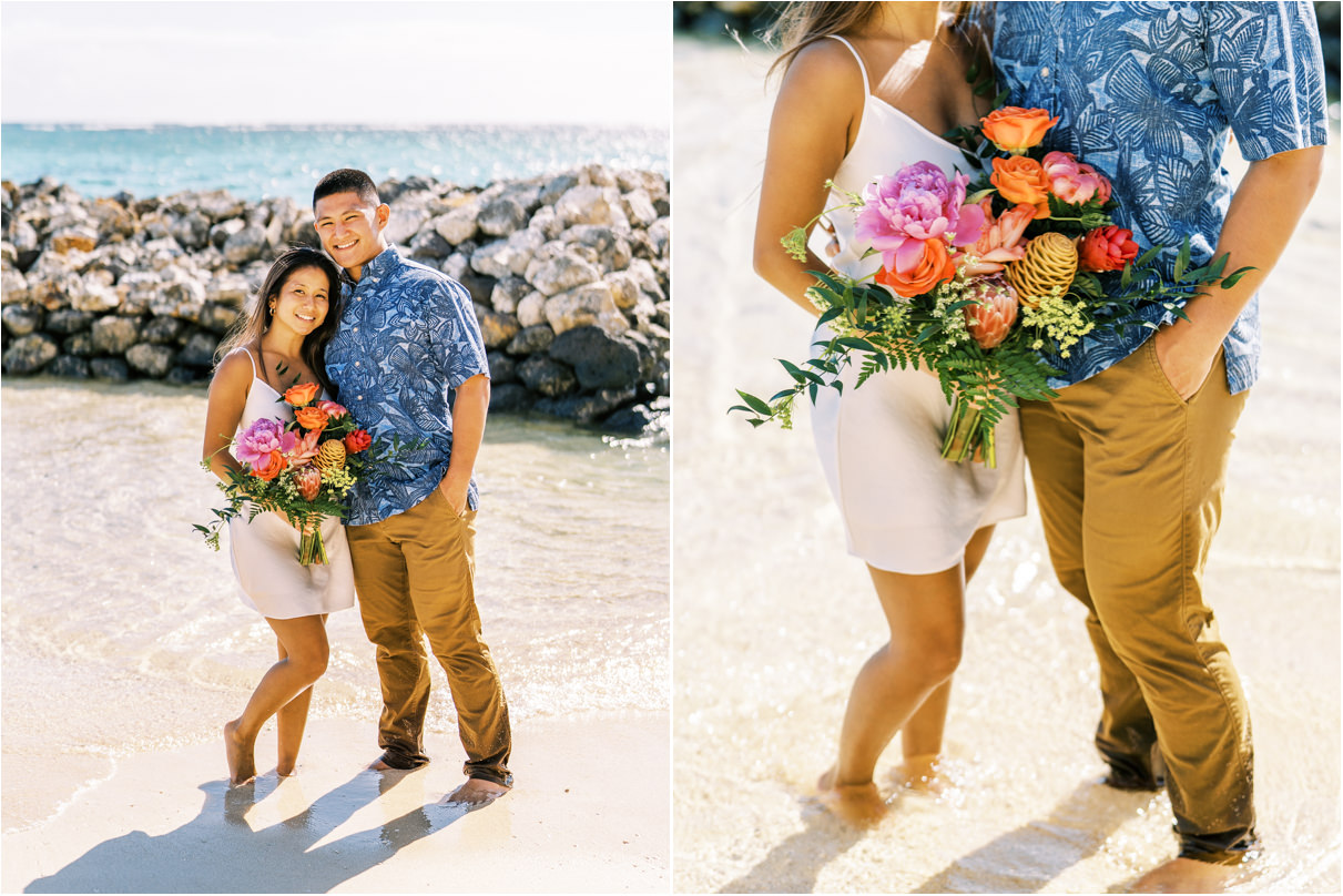 couple standing in water holding bouquet