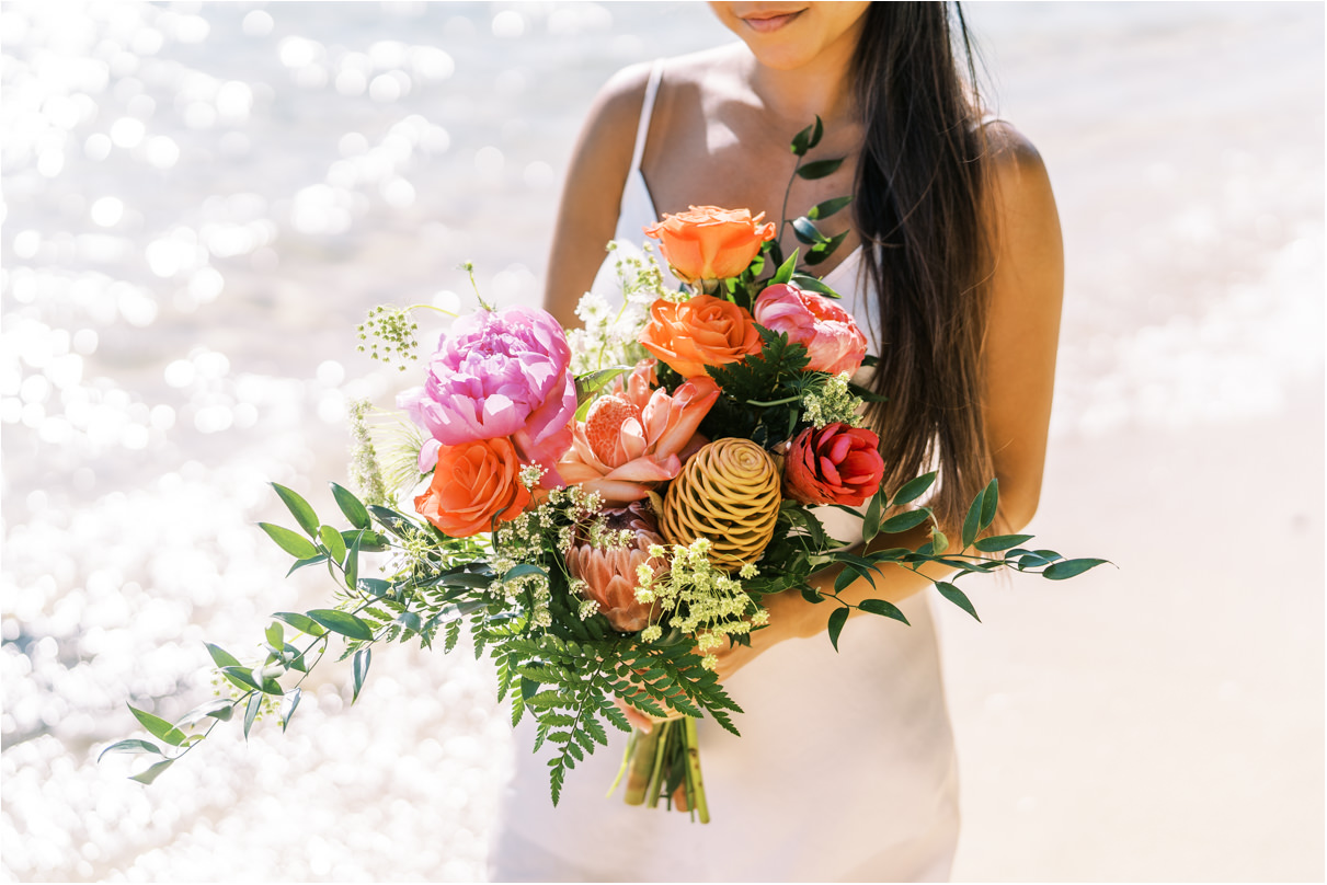 woman holding tropical bouquet 