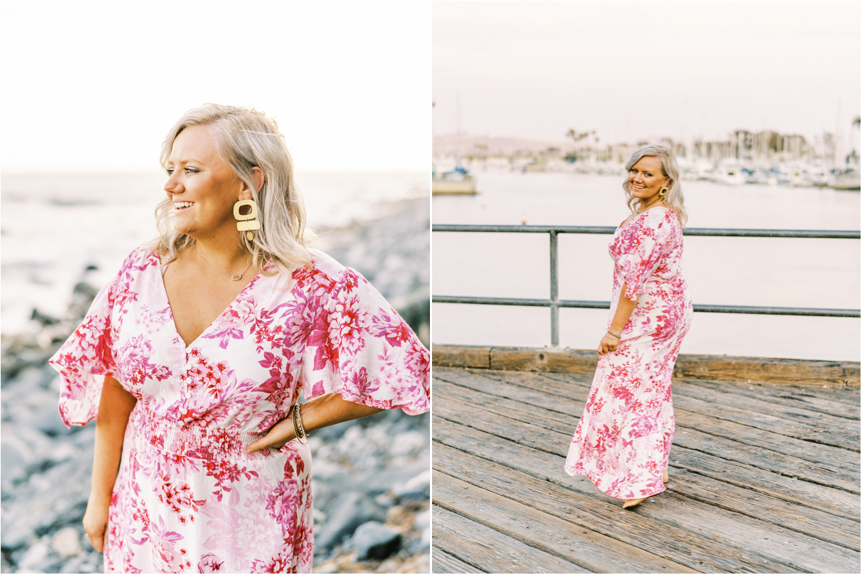 woman in pink floral flowy dress on pier at dana point harbor