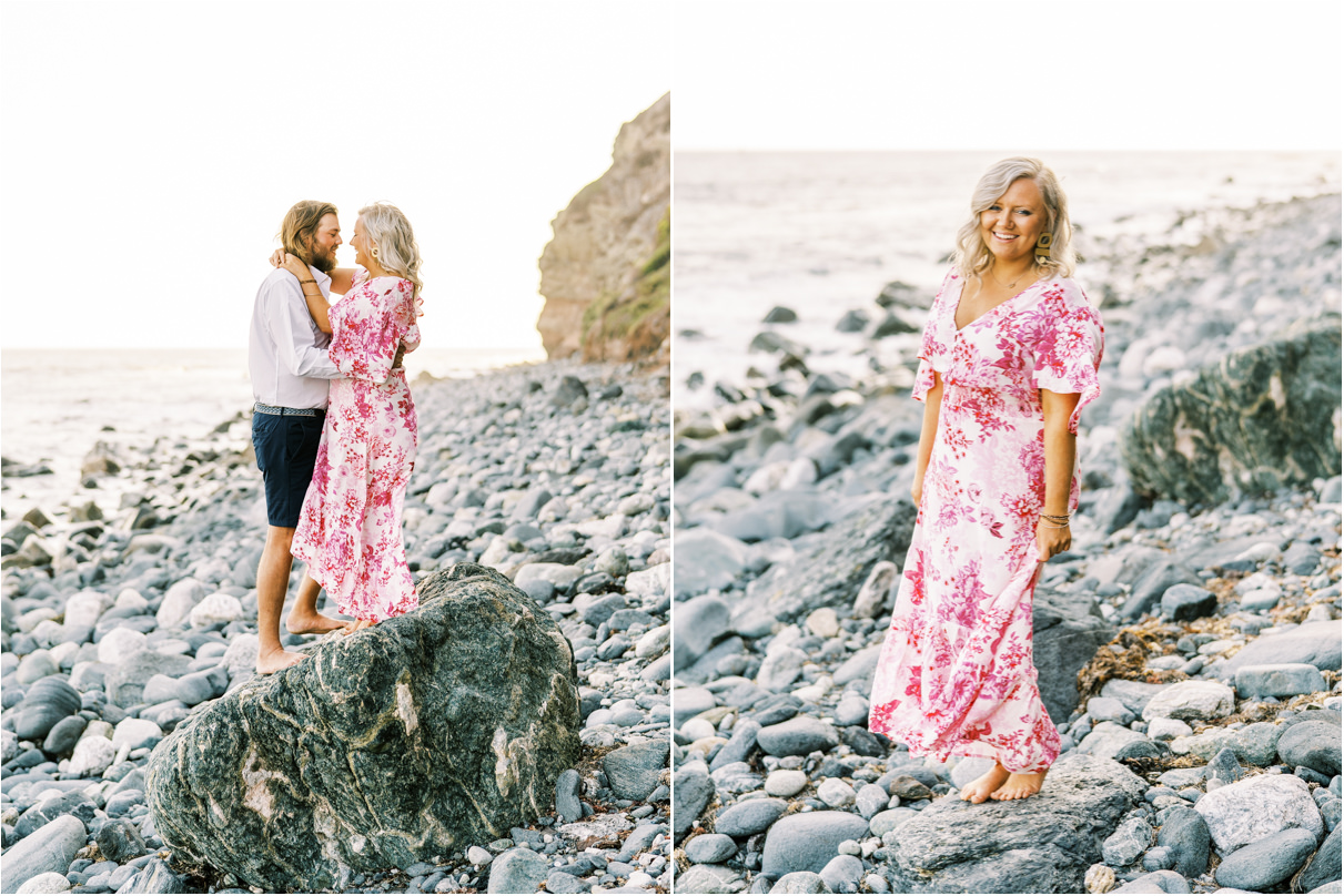 Couple standing on rocky beach looking at each other