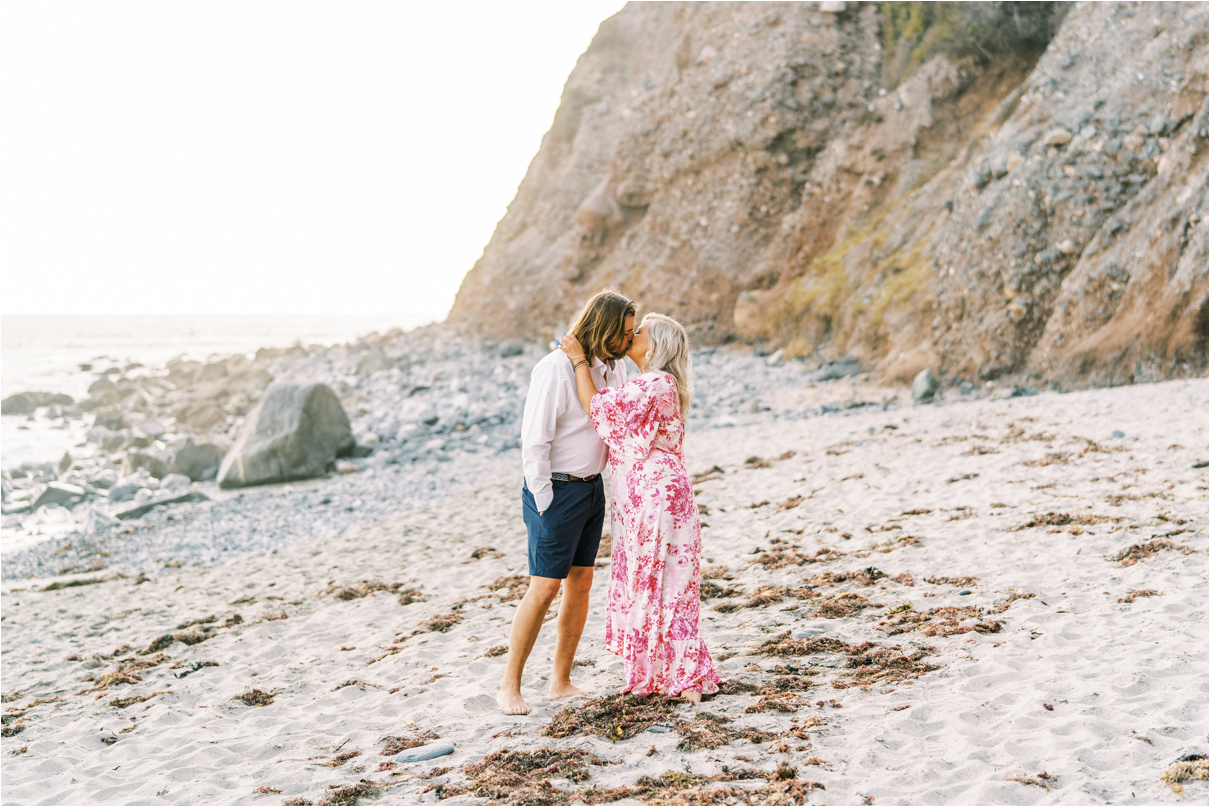 Couple kissing at engagement session in orange county