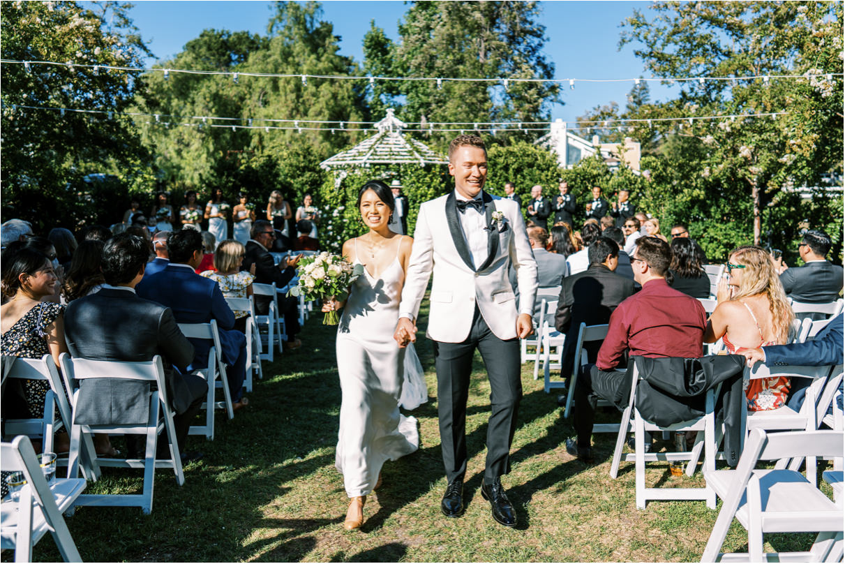 Bride and groom walking down aisle after ceremony