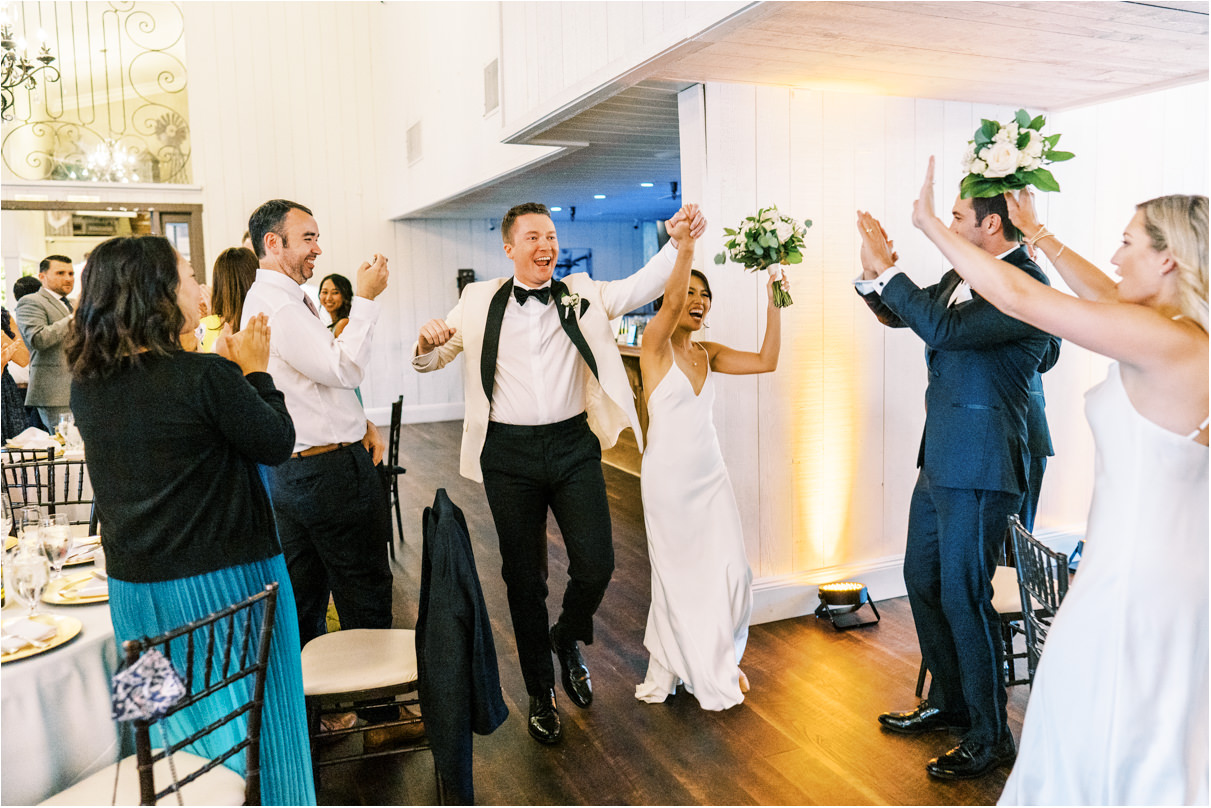 Bride and groom dancing while entering reception