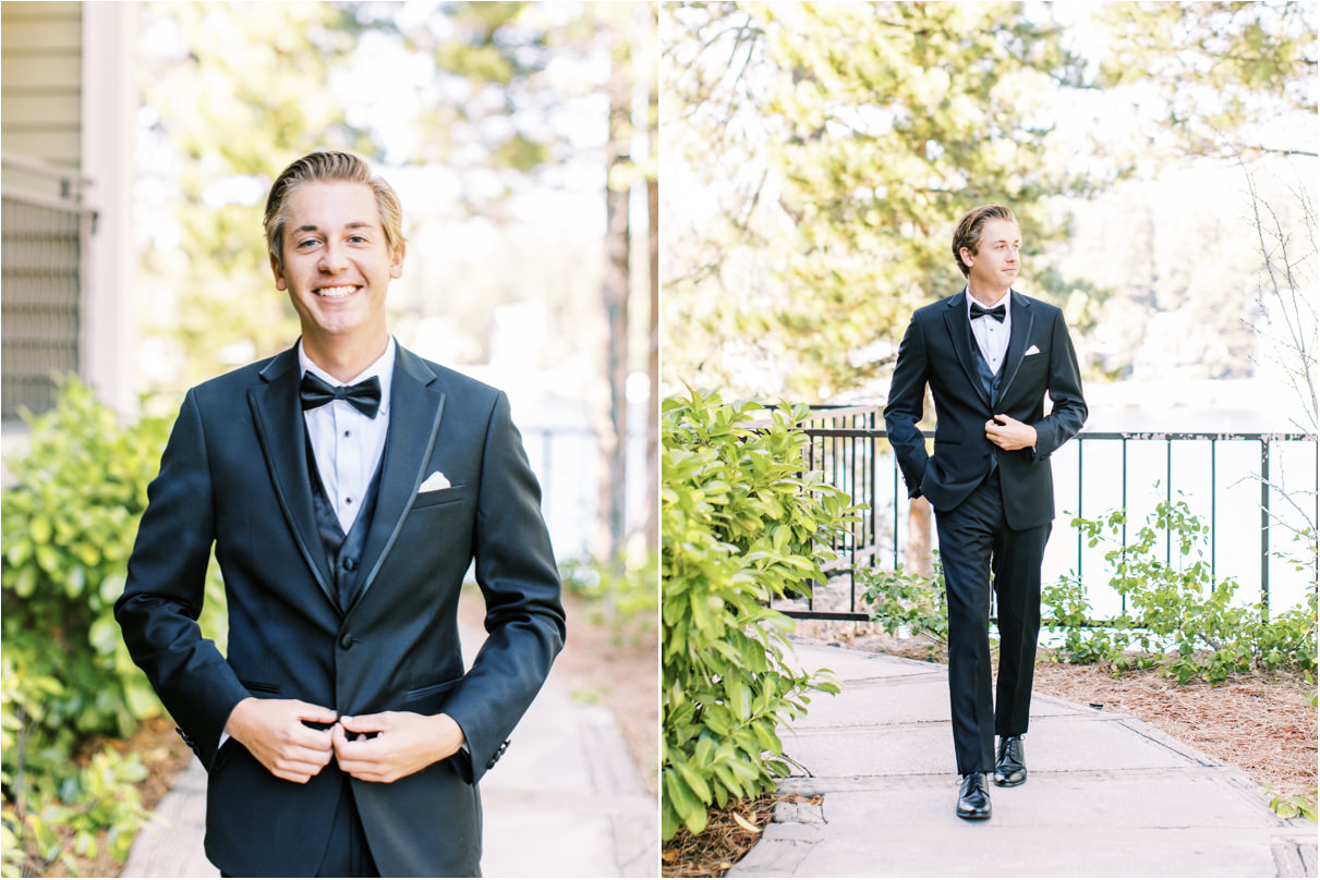 Groom buttoning suit jacket and walking in nature