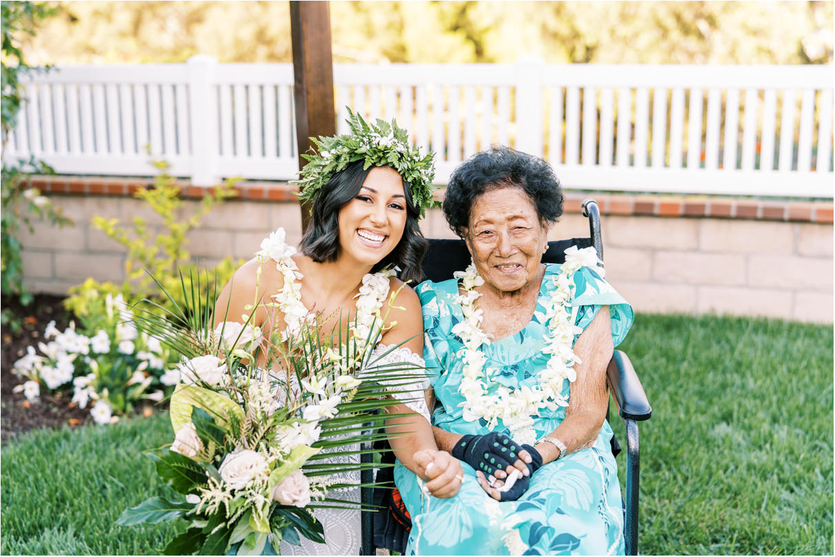 Bride with grandma smiling in wheelchair