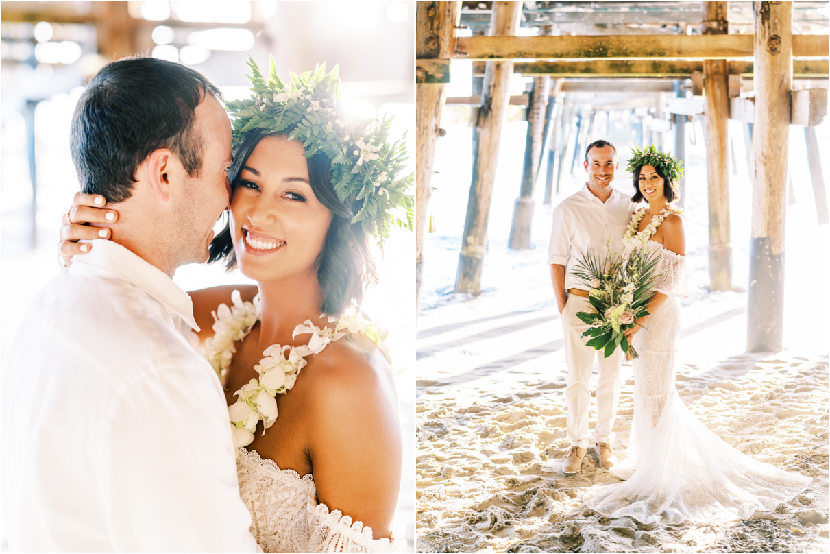 Bride and groom beneath San Clemente Pier smiling