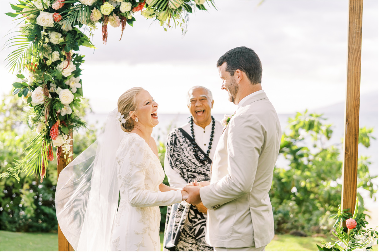 bride laughing at groom during wedding ceremony