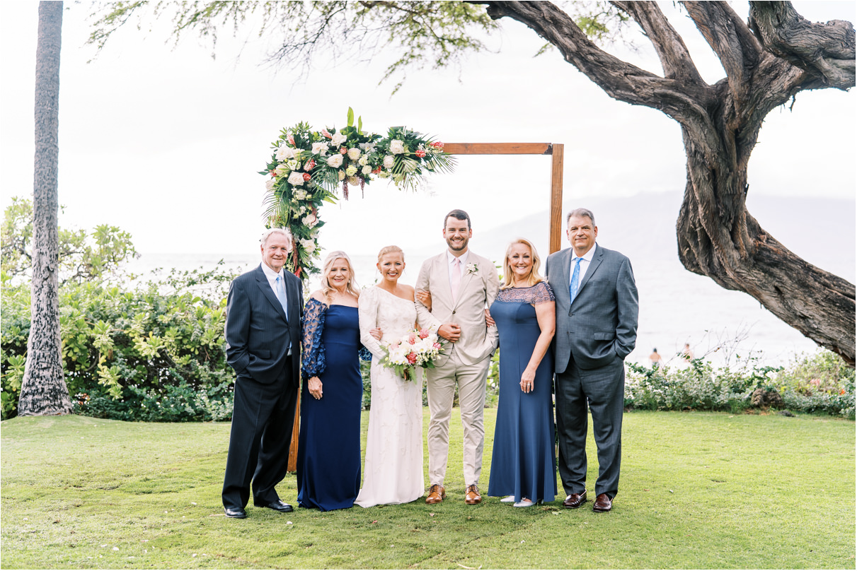 family photo under altar at Andaz maui taken by wedding photographer in maui