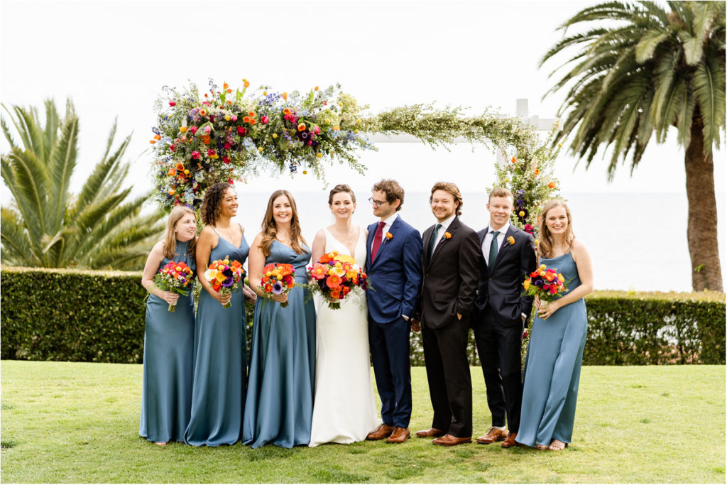 Wedding party laughing at bel air bay club lawn