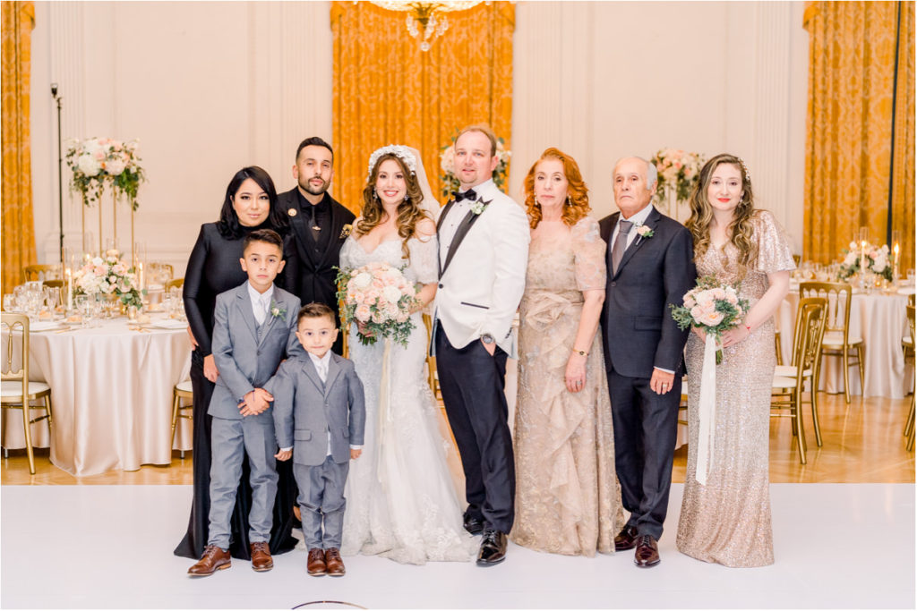 bride and groom with family at richard nixon library wedding venue