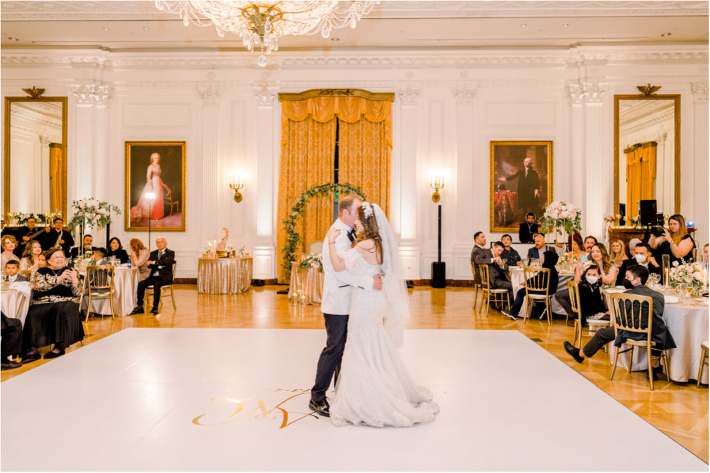 bride and groom on dance floor for first dance at richard nixon library wedding